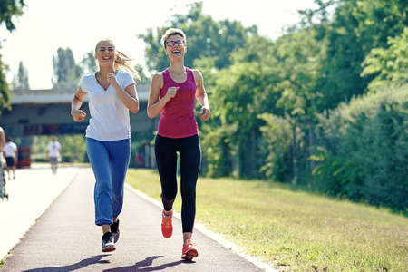 Two young woman is joging in the morning.の写真素材