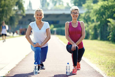 Two young woman is exercising in the morning.の写真素材