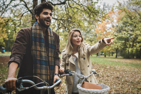 Young smiling couple enjoying in the park.の写真素材