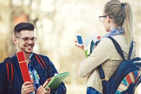Student couple happy because of succesful graduation.の写真素材