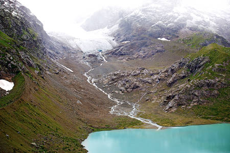 Spring is coming. Beautiful view on Swiss alps from Sustenpass.の写真素材