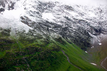 Spring is coming. Beautiful view on Swiss alps from Sustenpass.の写真素材