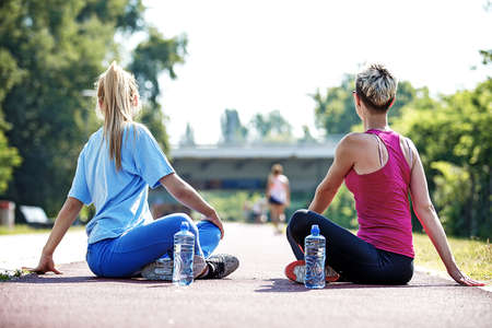 Two young women practice yoga in the morning.の写真素材