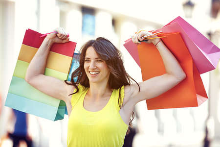 Young and attractive woman is enjoying shopping.の写真素材