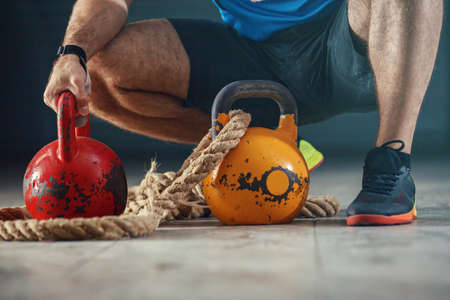 Young strong man is  training with kettlebell.の写真素材