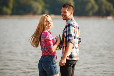 Happy couple enjoying Sunny day on the Danube river.の写真素材