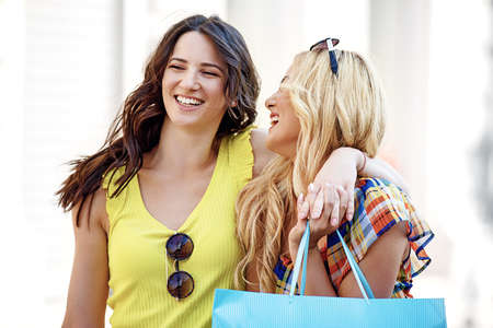 Young and attractive women enjoying shopping.の写真素材