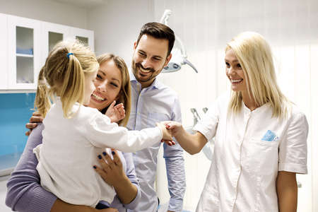 Cute blonde child first time in dental office.の写真素材