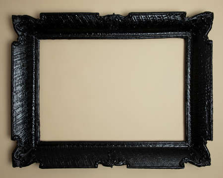Black vintage frame, with useful light brown background.の写真素材