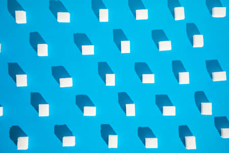 pattern with sugar cube on blue background.の写真素材