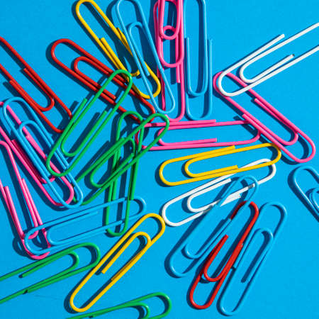 colorful paper clips on a white background. School, and eduaction idea.の写真素材