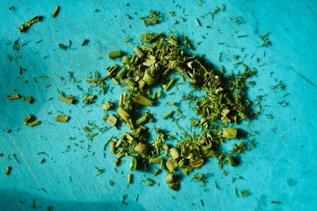 green onions and dill chopped on a boardの写真素材