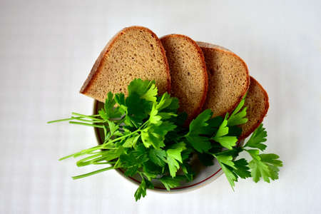 slices of bread, parsley on a white backgroundの写真素材