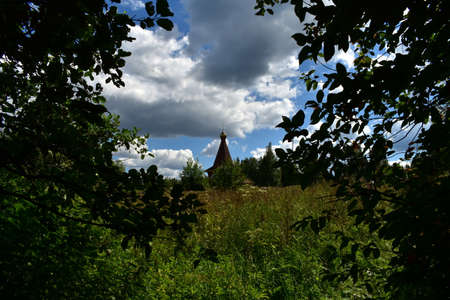 the roof of the chapel in a clearing in the forestの写真素材