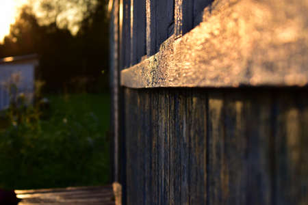 wall of boards in the rays of sunsetの写真素材