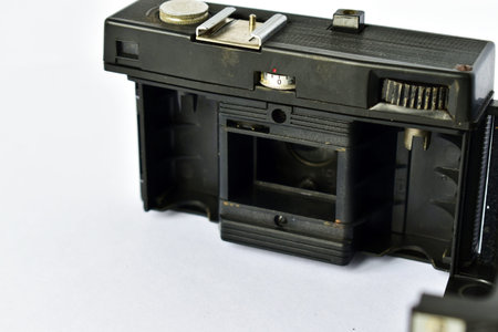 dusty old camera with open back cover