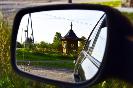 village little chapel in the car mirror