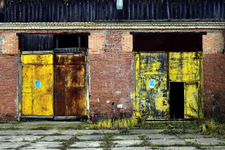 old truck gate in an abandoned buildingの写真素材