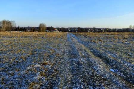 frozen meadow near the villageの写真素材
