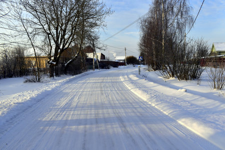 snowy village street on a frosty dayの写真素材