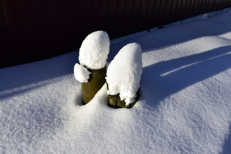 the pillar is covered with snowの写真素材