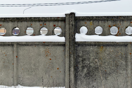 fragment of a fence made of concrete slabsの写真素材
