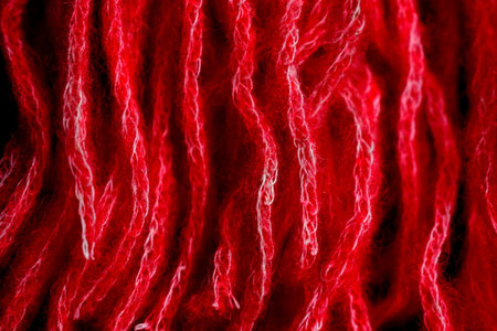 thick threads of red woolの写真素材