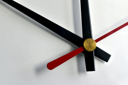 the hands of the clock on the dialの写真素材
