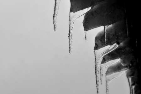 icicles hanging from the roofの写真素材