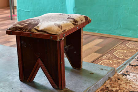 old chair on metal floorの写真素材