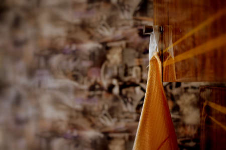 a waffle towel hanging on the cabinet door handleの写真素材