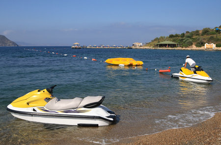 Watersports, scooters on the sea over coastline of beach