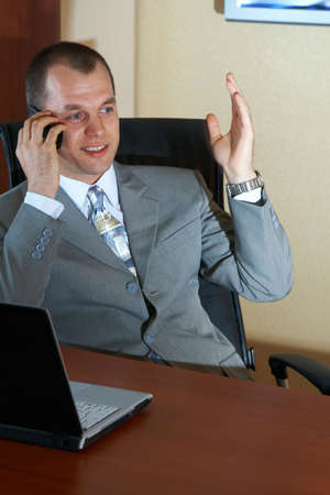 Businessman talking by the phoneの写真素材