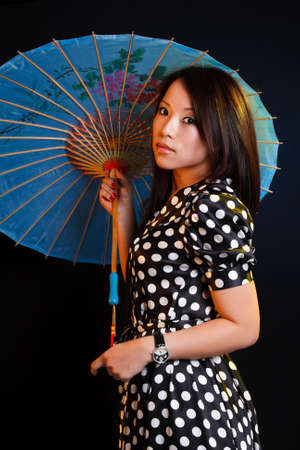 geisha posing isolated on blackの写真素材