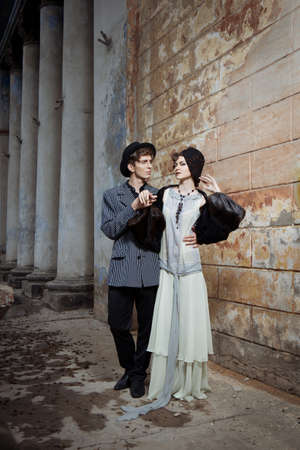 Retro styled fashion portrait of a young couple.の写真素材