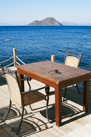 chairs and table in beach cafeの写真素材
