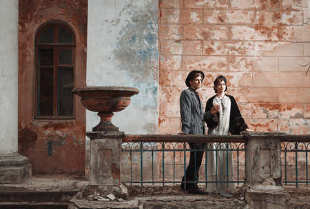 Retro styled fashion portrait of a young couple. Clothing and make-up in 1920s style.の写真素材