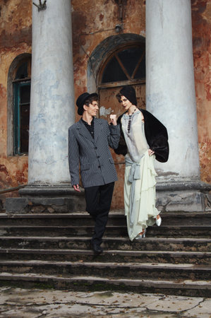 Retro styled fashion portrait of a young couple. Clothing and make-up in 1920s style.