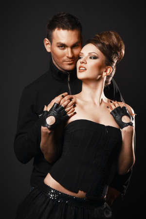 Couple in love. Happy loving couple. Dark background.の写真素材