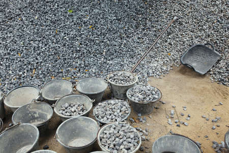 Pile of rocks for construction  Buckets for tranportation の写真素材
