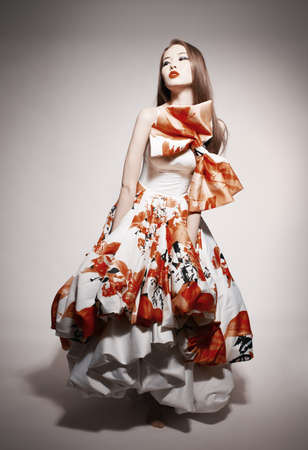 young beautiful asian brunette in gorgeous dressの写真素材