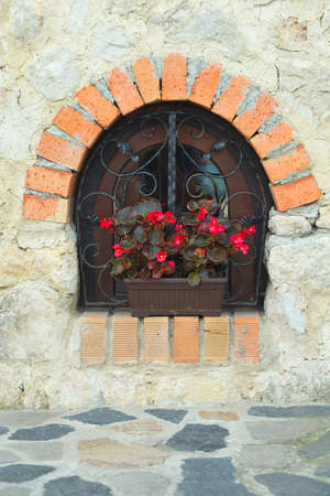 Ornate window with flowersの写真素材