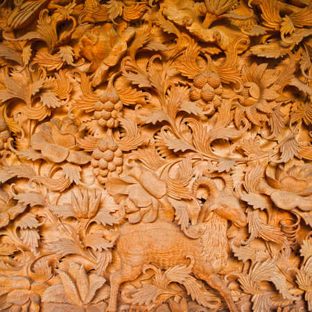 Section of an ancient mural wood carving from Baliの写真素材