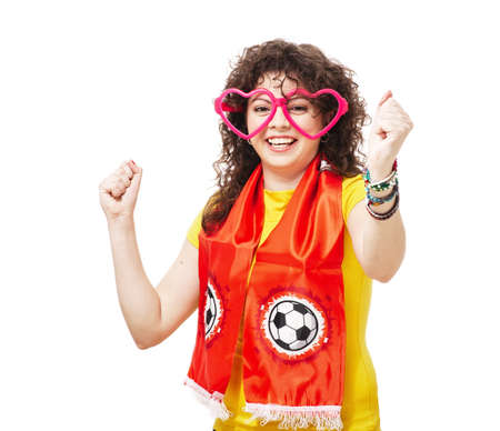 Football or soccer woman fan screaming with supporter attributes isolated on whiteの写真素材