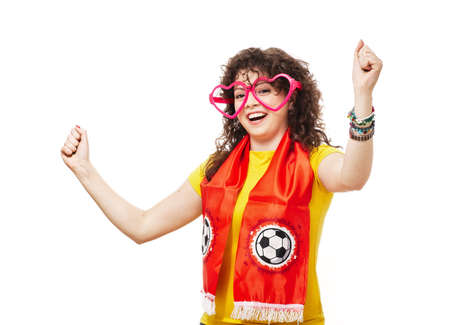 Football or soccer woman fan screaming with supporter attributes isolated on whiteの写真素材