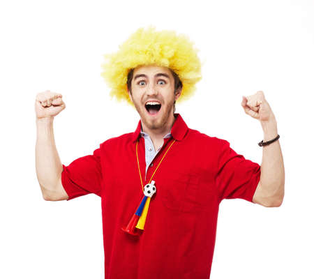 Football or soccer fan screaming with supporter attributes isolated on whiteの写真素材