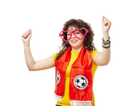 Football or soccer woman fan screaming with supporter attributes isolated on whiteの写真素材