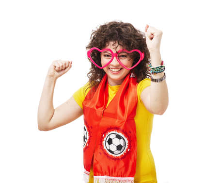 Football or soccer woman fan screaming with supporter attributes isolated on whiteの写真素材
