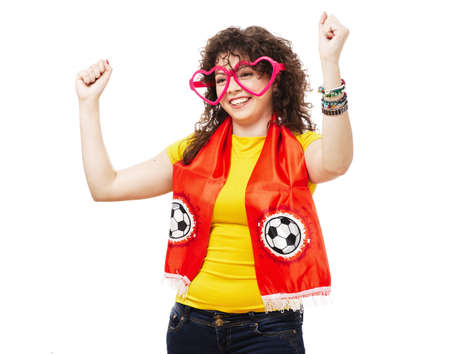 Football or soccer woman fan screaming with supporter attributes isolated on whiteの写真素材