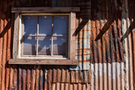 A rusty corrugated metal shedの写真素材